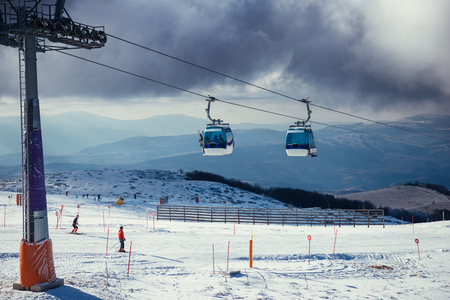 Ski lift on a cloudy winter sky.の写真素材