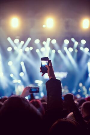 Mobile photographer capturing favorite artist and stageの写真素材