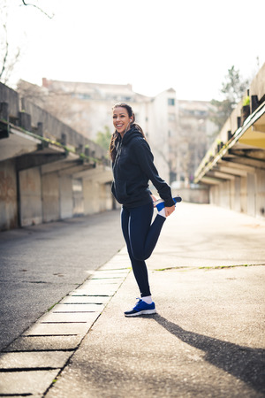 Woman stretching her leg muscles.の写真素材