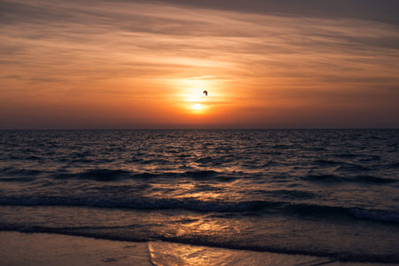Shot of a beautiful sunset on the beach.の写真素材