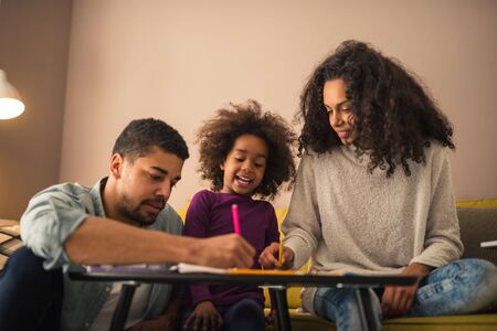 Parents drawing with their little girl.の写真素材