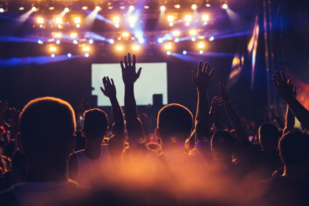 Crowd raising their hands and having fun on the concert.の写真素材
