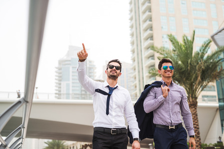 Two handsome businessmen enjoying a business traveling.の写真素材