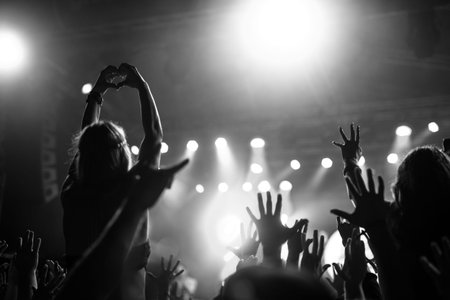 Girl raising her hands and showing love.