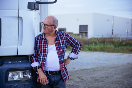 Senior trunk driver posing next to his trunk.の写真素材