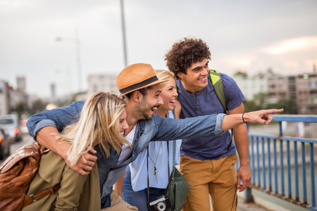 Friends enjoying traveling together in the city.の写真素材