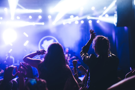 Crowd raising hands and enjoying great festival vibes.の写真素材