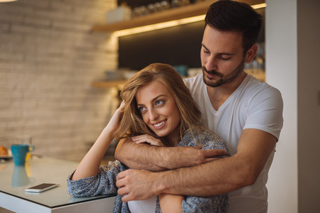 Couple sharing affectionate moment in the morning.の写真素材