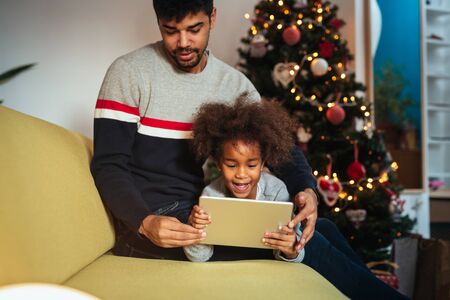 Having fun together while using a tablet together.の写真素材