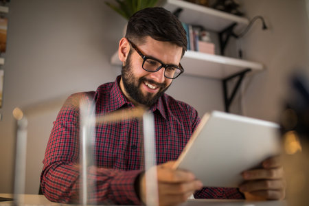 Shot of a young male using digital tablet.