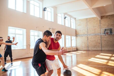 Two basketball players playing one on one.の写真素材