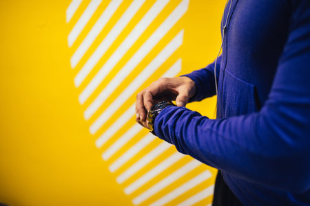 Close up of a man checking his workout time.