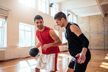 Two basketball players playing one on one.の写真素材