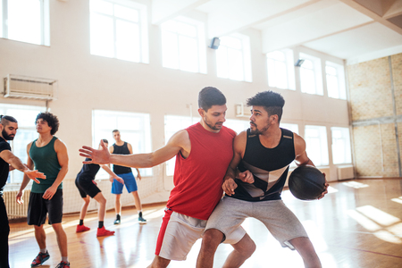 Portrait of basketball players playing basketball in school.の写真素材