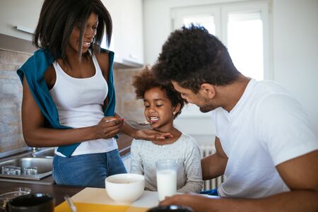 Photo of african american family having breakfast together.の写真素材