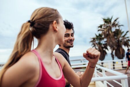 Happy couple enjoying an afternoon jog together.の写真素材