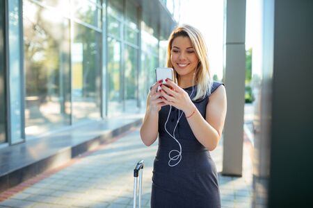 Attractive woman having a video call on a mobile phone.の写真素材