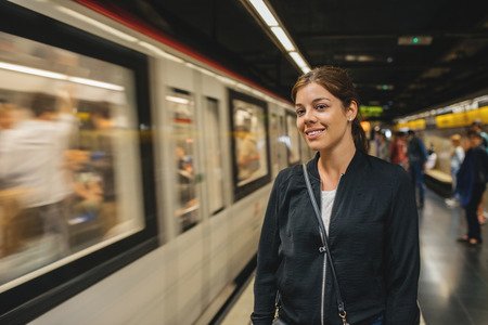 Young girl waiting for metro train in the underground station.の写真素材