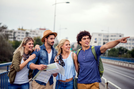 Happy friends enjoying sightseeing tour in the city.