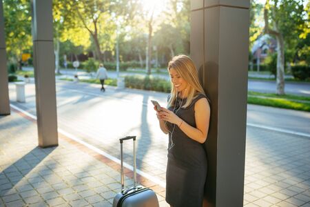 Attractive woman having a video call on a mobile phone.の写真素材