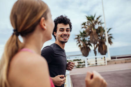 Happy couple enjoying an afternoon jog together.の写真素材