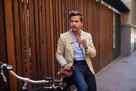 Handsome stylish man posing in the city.の写真素材