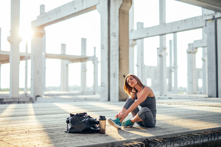 Beautiful woman getting ready for training outdoors.の写真素材