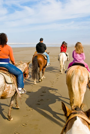 A Group of People Enjoying Horseback Ridingの写真素材