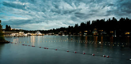Sunset Reflection At Meydenbauer Beach Park In Between Swimming Lanes In Bellevue, Washington, United States, the purple aura filled the lakeside with peace and serenity.の写真素材