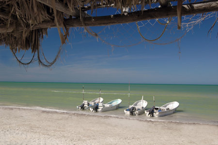 Boats on a beach in Celestun on the Yucatan Peninsula in Mexico.