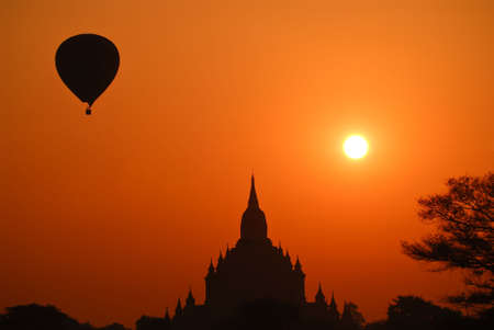 Hot air balloon over a temple at Bagan, Myanmar at sunsriseの写真素材