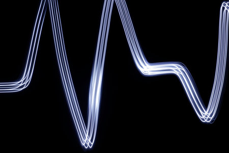 Photograph of an abstract light drawing with a long exposure effect