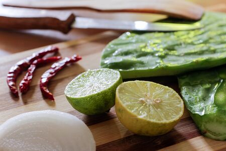 Photograph of some fresh vegetables on a wood tableの写真素材
