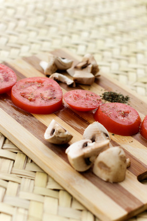 Photograph of a wood cutting board with vegetablesの写真素材