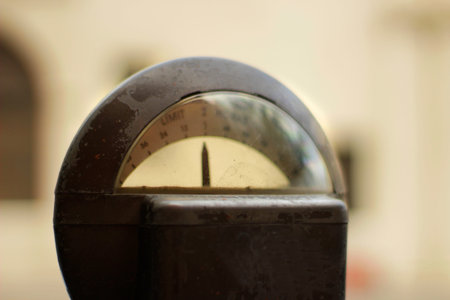 Photograph of a metal old rusty parking meter closeup and blurred backgroundの写真素材