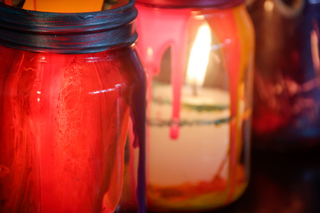 Photograph of some colorful cristal lamps with a wax candle insideの写真素材
