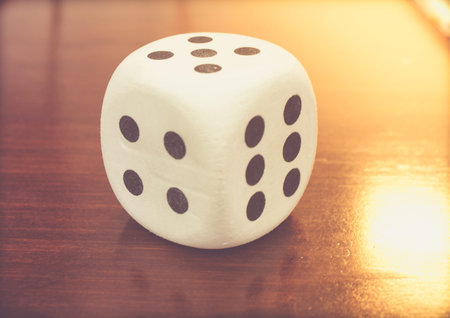 Photograph of a Toy dice on wood table