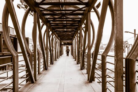 Photograph of a metal pedestrian bridgeの写真素材