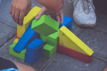 Photograph of some kids playing with blocksの写真素材