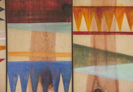 Photograph of some abstract colorful geometric pattern on wood boards