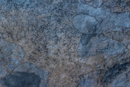 Photograph of a stone cracked wall texture or backgroundの写真素材