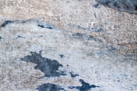 Photograph of a stone cracked wall texture or backgroundの写真素材