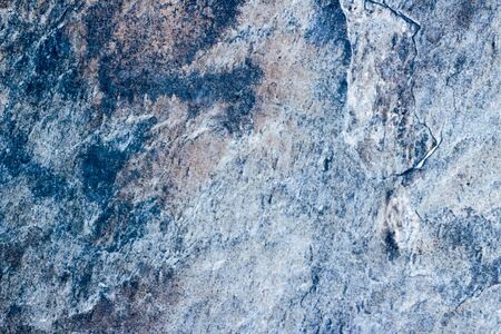 Photograph of a stone cracked wall texture or backgroundの写真素材