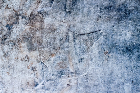 Photograph of a stone cracked wall texture or background