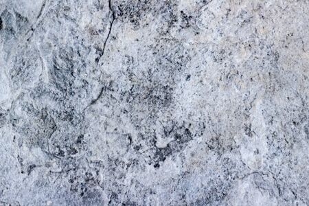 Photograph of a stone cracked wall texture or backgroundの写真素材
