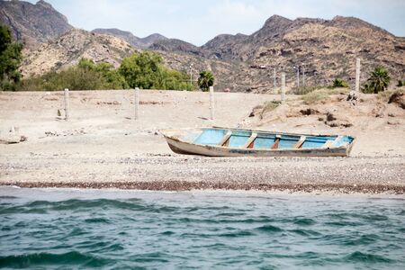 Photograph of an abandoned boat on the beachの写真素材