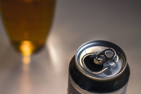 Photograph of a can and glass of beerの写真素材