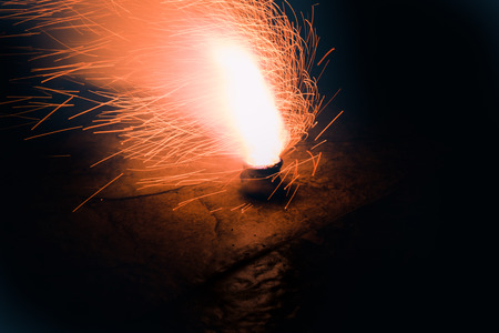 Photograph fo some Fire works and sparkles on dark backgroundの写真素材