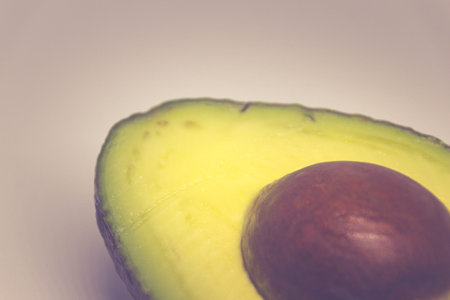 Photograph of a fresh green avocado