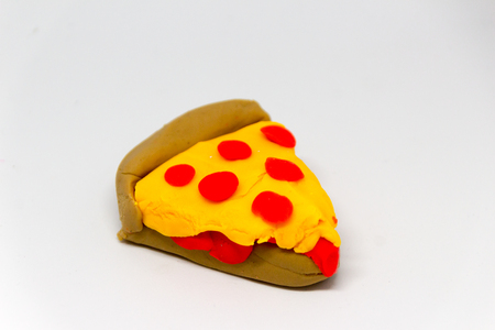 Photograph of a plasticine slice of pizzaの写真素材